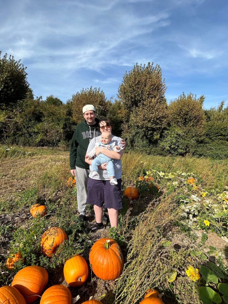 family in the pumpkin patch